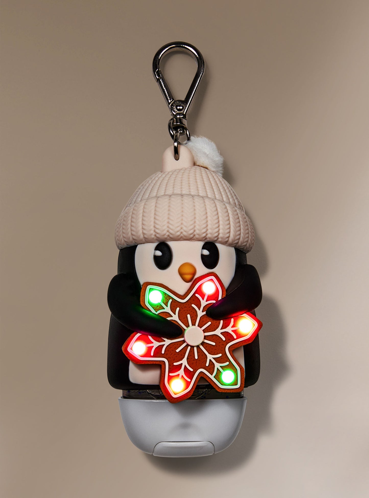 Porta gel pingüino con galleta iluminada
